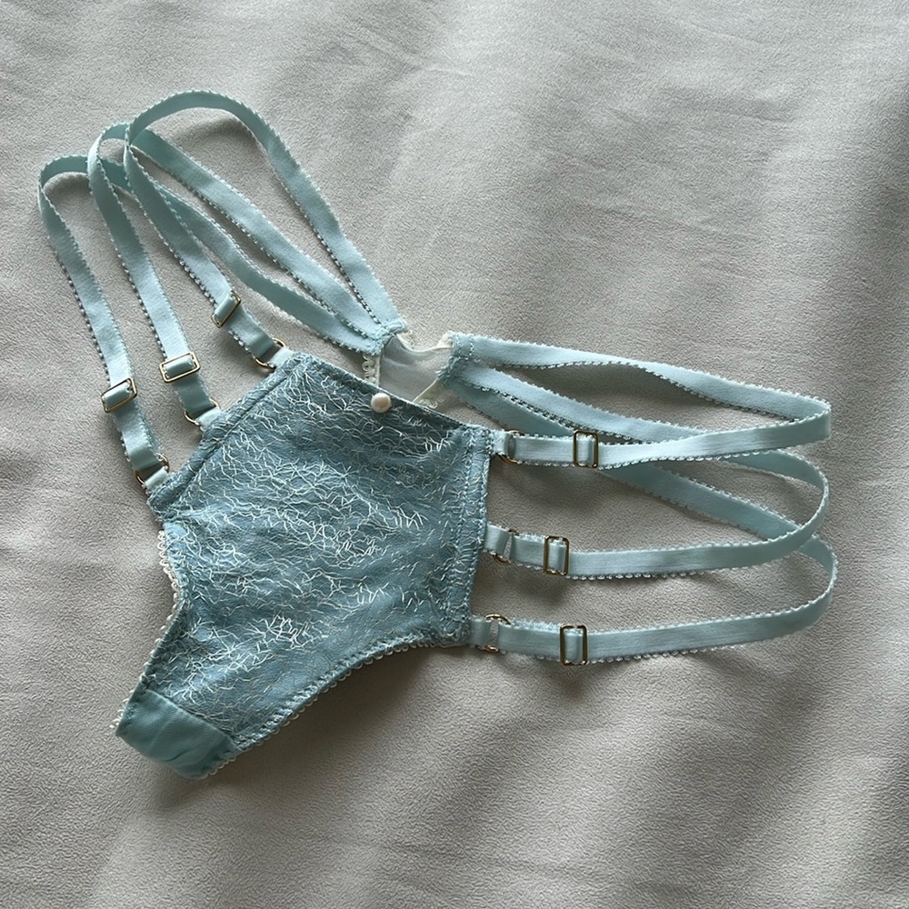 E.L.F. Zhou adjustable strap thong size M